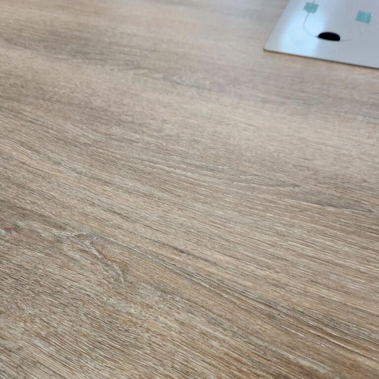 close up showing the textured wood grain of the Ryker conference table