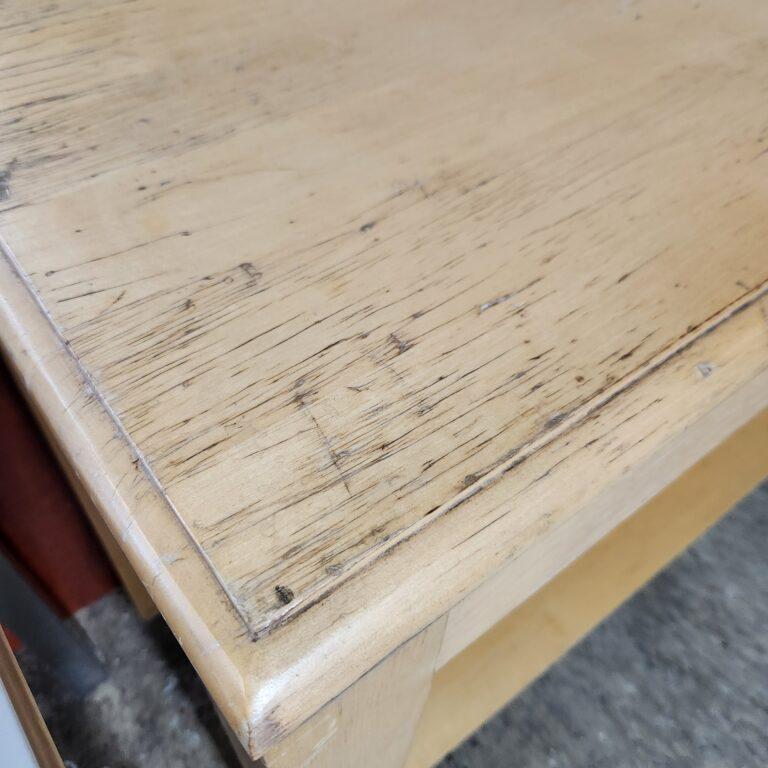 detail of wear and tear on the top of the sofa table