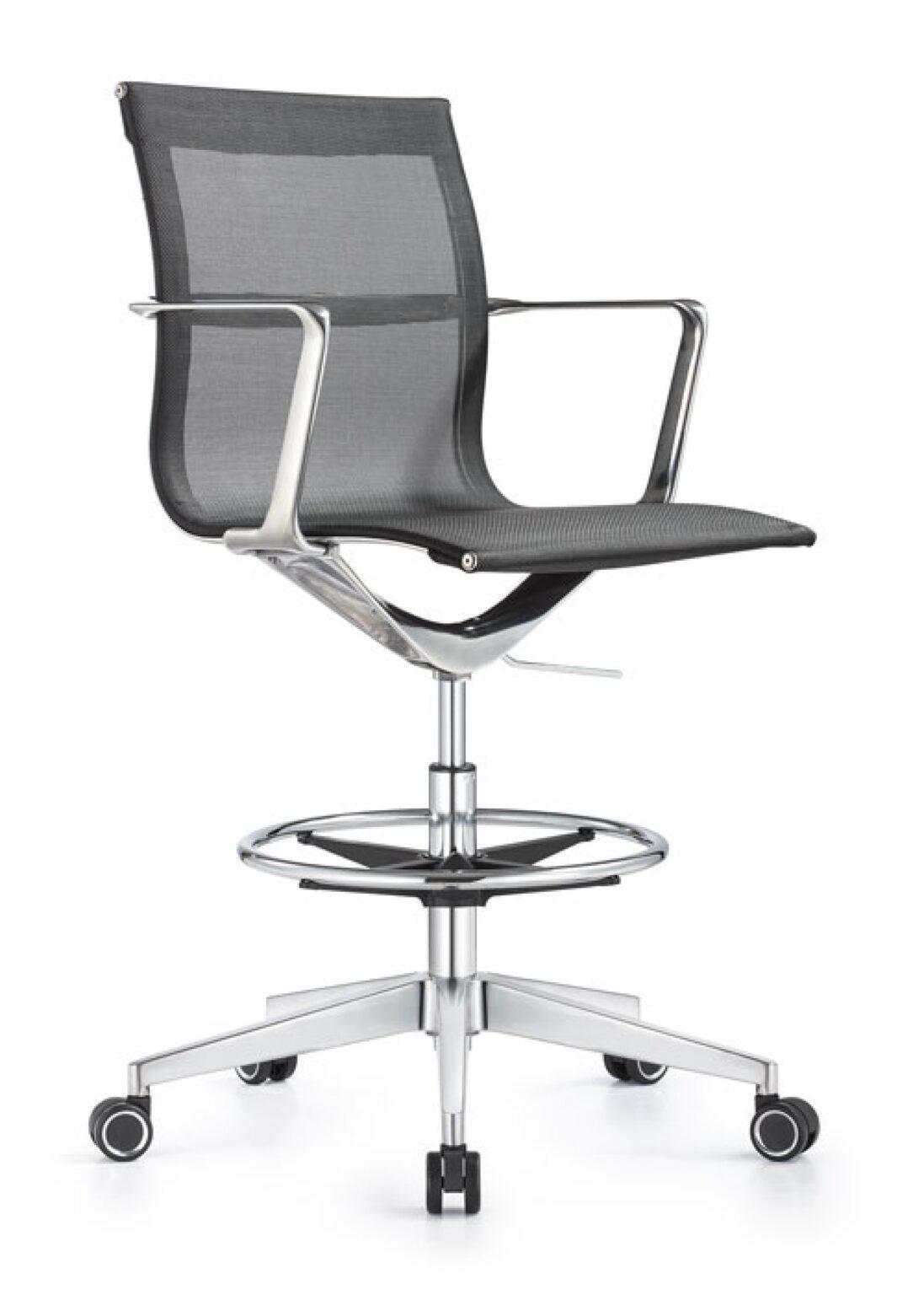 A Joan office stool featuring black mesh upholstery, chrome armrests, a circular footrest, and a five-star chrome base with black and silver casters.