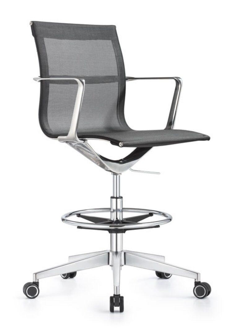 A Joan office stool featuring black mesh upholstery, chrome armrests, a circular footrest, and a five-star chrome base with black and silver casters.