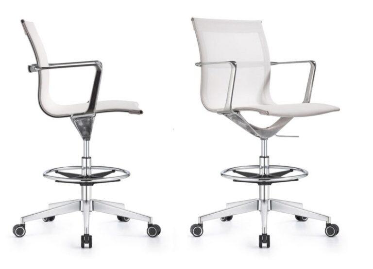 Two Joan office stools shown from profile and front-facing angles, featuring white mesh upholstery, chrome armrests, a circular footrest, and a five-star chrome base with casters.