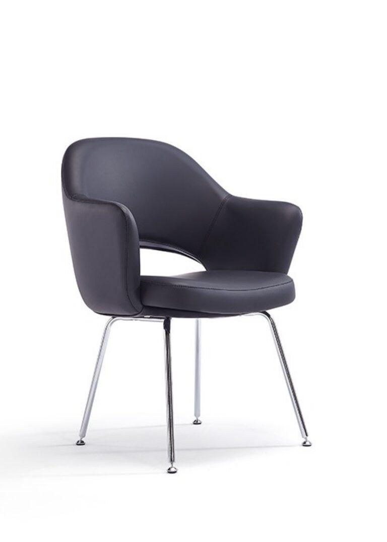 A Melanie guest seating chair with black faux leather upholstery, integrated arms, a cutout back, and four chrome legs.