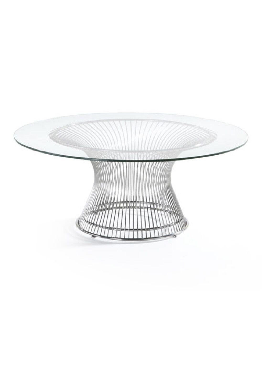 A Santana coffee table with a round glass top and a polished chrome wire base in a flared pedestal shape.