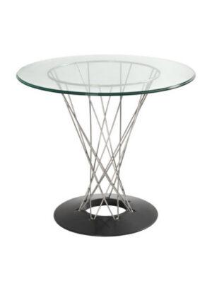 A Guthrie bistro table featuring a round, tempered glass top supported by a sculptural chrome wire pedestal base. The base is constructed from a series of intersecting thin metal rods that form an elegant hourglass shape, tapering at the center before flaring out to anchor into a solid, flat circular black ring base.